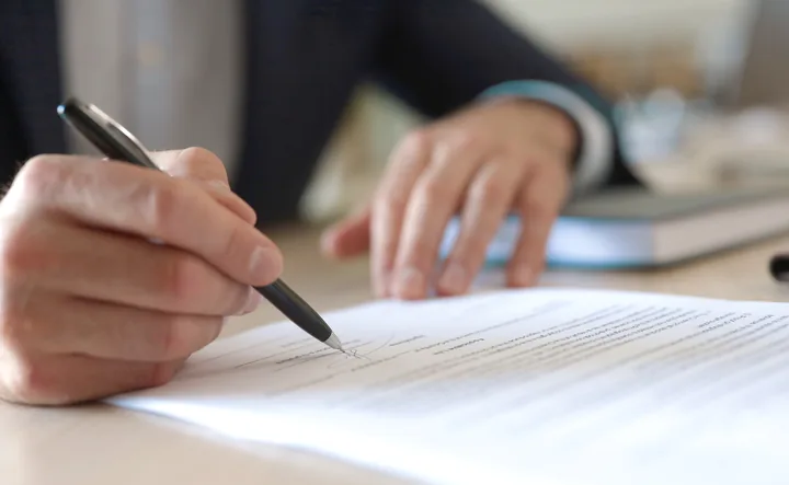 Man signing permit documents